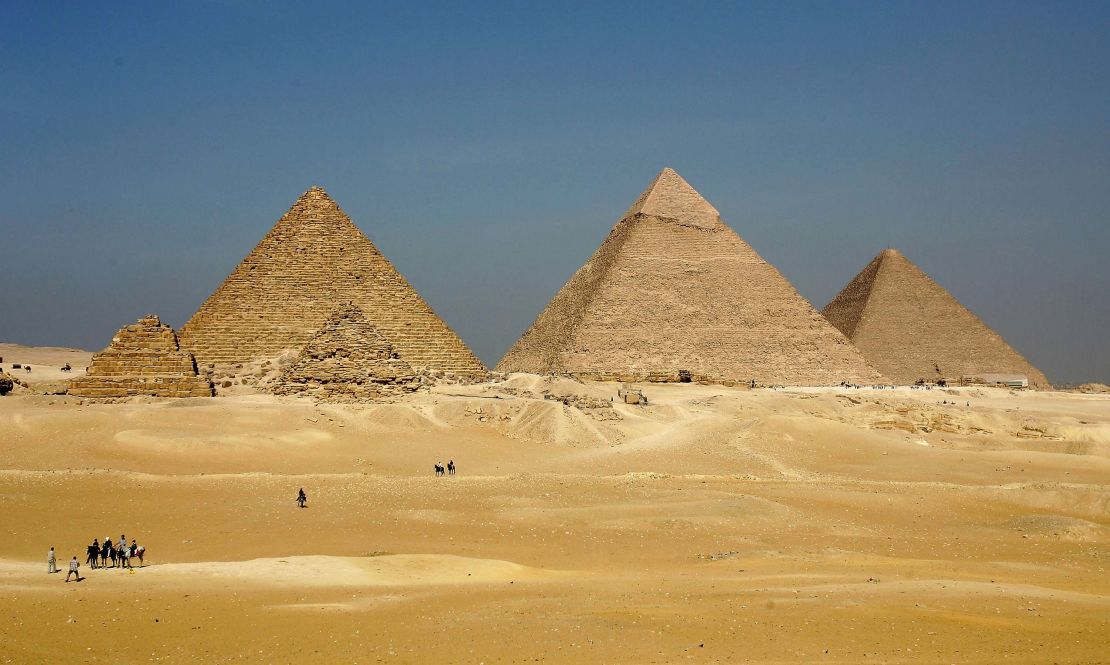 Three enormous pyramids loom over the horizon at Giza.