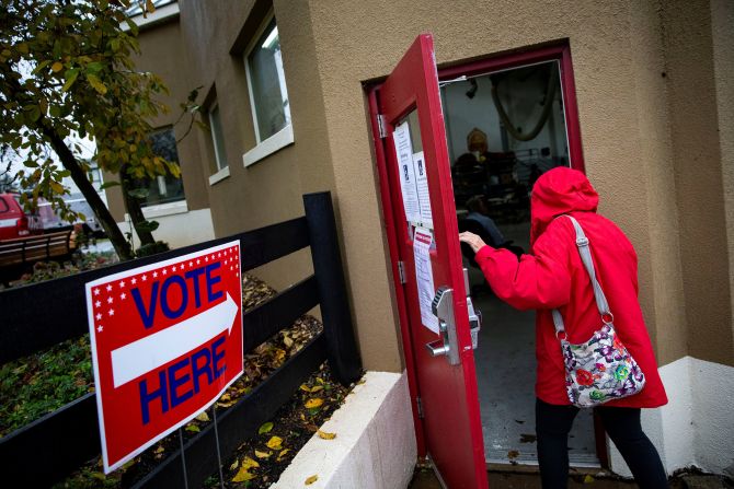 A woman arrives to vote at the Philomont Fire Station in Purcellville, Virginia.