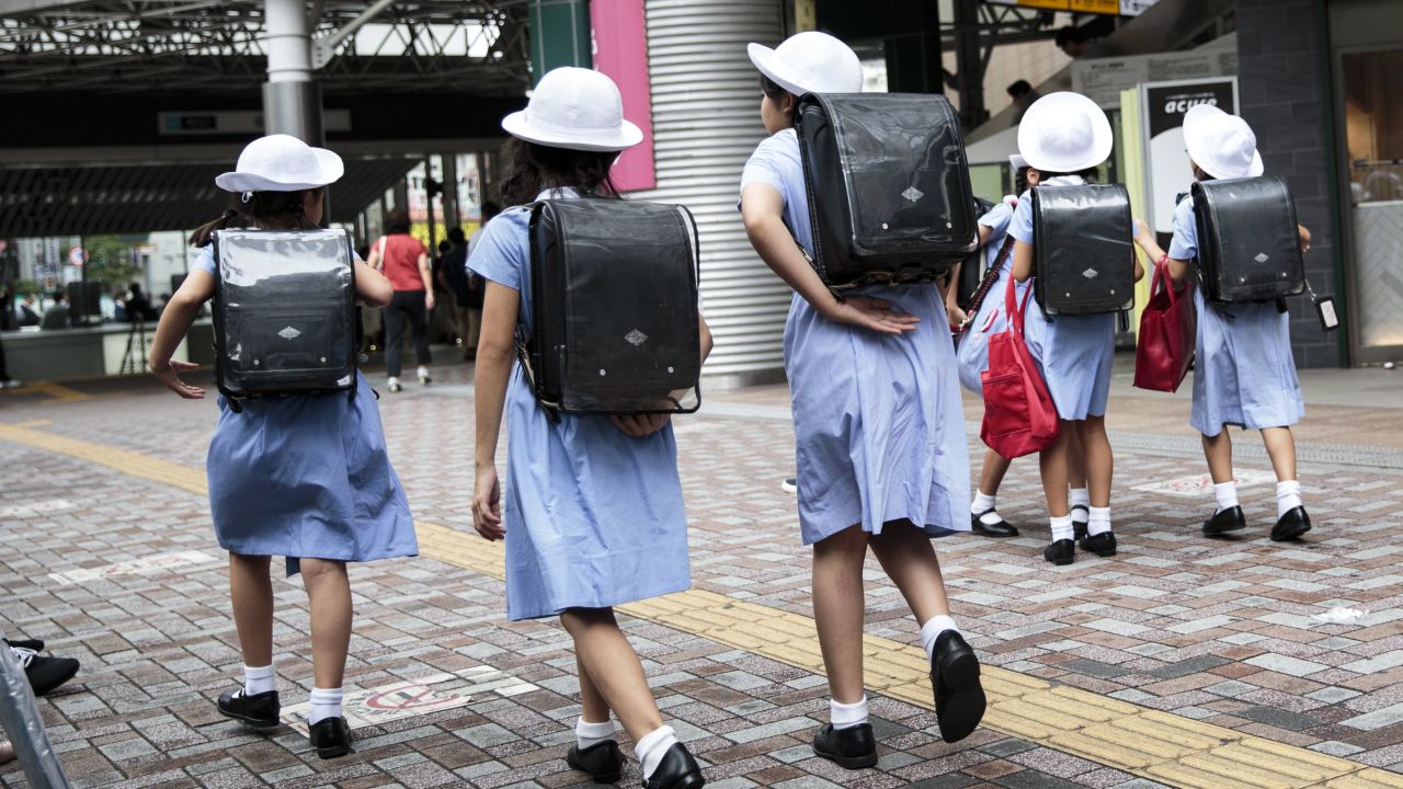 Schoolgirls walk home at Ebisu district in Tokyo on September 4, 2017. Young people are killing themselves in Japan at a high rate. 