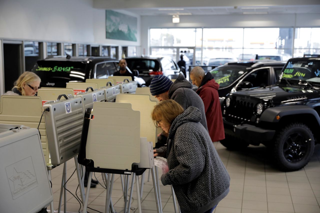 Voters cast their ballots at a car dealership in Chicago.