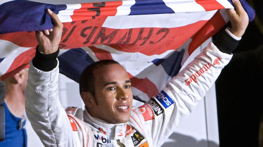 British Formula One driver Lewis Hamilton waves his national flag to celebrate after winning the F-1 World Championship on November 2, 2008, at Interlagos race track in Sao Paulo, Brazil. Hamilton was crowned Formula One champion after finishing fifth in the Brazil Grand Prix.   AFP PHOTO / ANTONIO SCORZA (Photo credit should read ANTONIO SCORZA/AFP/Getty Images)