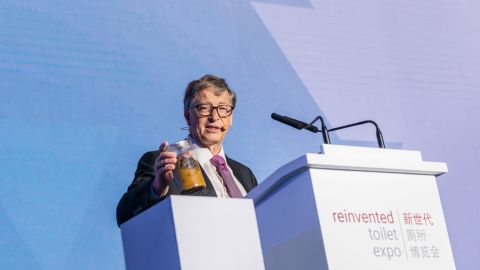 Bill Gates shocks the audience with a jar of human excrement.