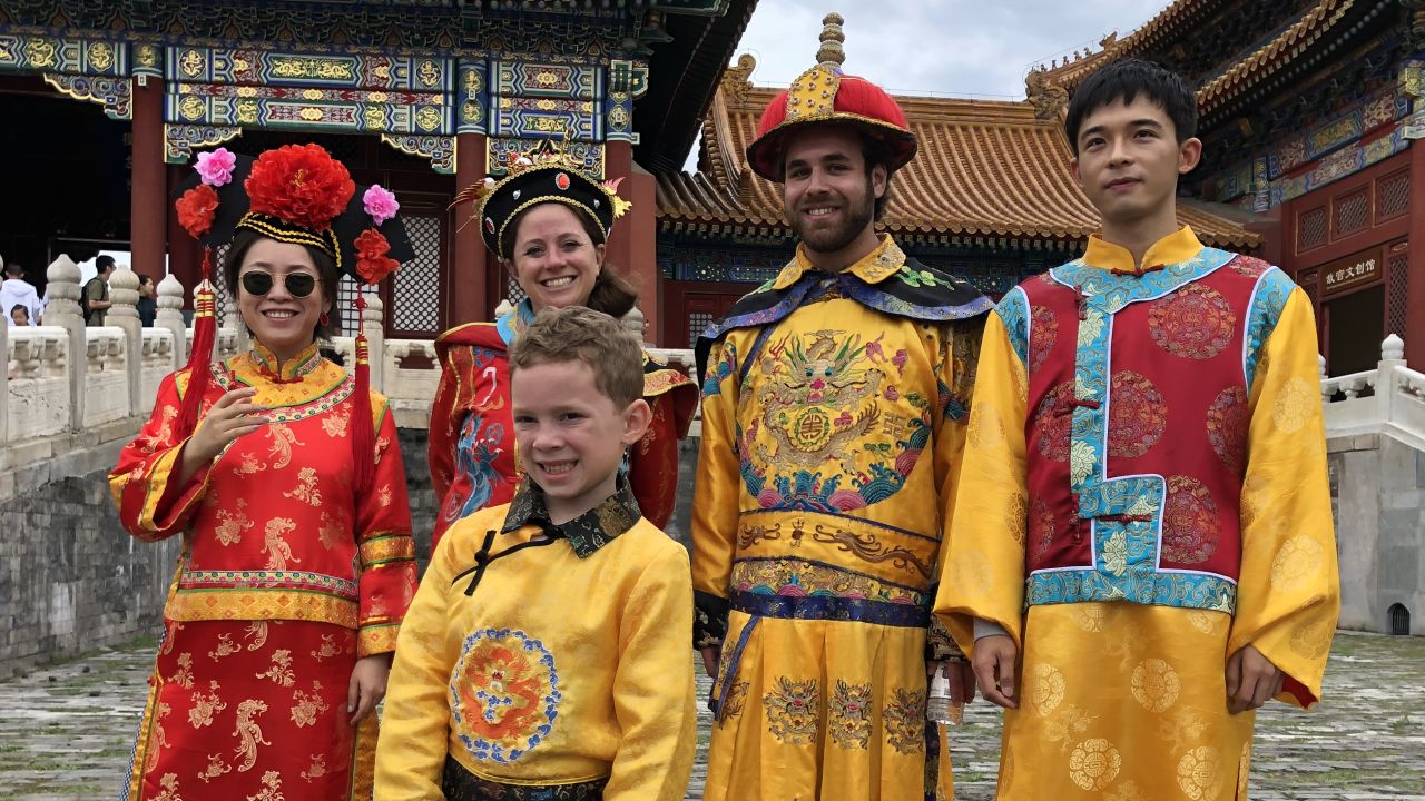 A photo of Gavin in Beijing's Forbidden City was captioned, "I'm dressed in an imperial robe, but I'm not really happy."