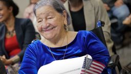 Maria Valles Bonilla, 106, smiles after participating in a naturalization ceremony at U.S. Citizenship and Immigration Services office Tuesday, Nov. 6, 2018, in Fairfax, Va. Bonilla is from El Salvador and it was her late husband's dream to become a U.S. citizen, so today she became a citizen for both of them. (AP Photo/Pablo Martinez Monsivais)