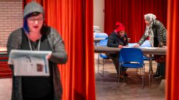 Voters cast ballots at a polling station in Minneapolis, Minnesota on November 6, 2018. - Americans started voting Tuesday in critical midterm elections that mark the first major voter test of US President Donald Trump's controversial presidency, with control of Congress at stake. (Photo by Kerem Yucel / AFP)        (Photo credit should read KEREM YUCEL/AFP/Getty Images)