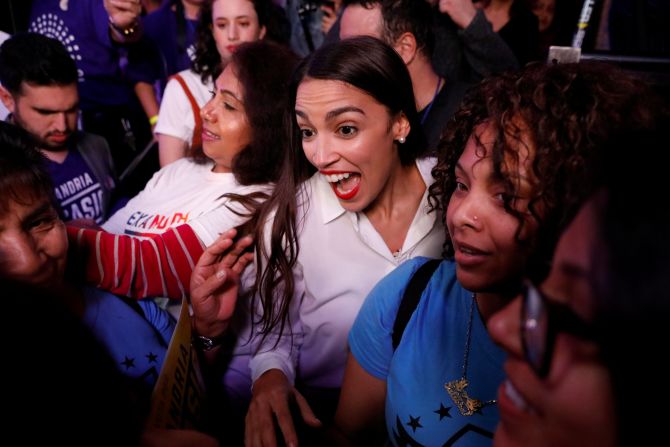 Democratic congressional candidate Alexandria Ocasio-Cortez greets supporters at her election-night party in New York. At 29, she is <a href="index.php?page=&url=https%3A%2F%2Fwww.cnn.com%2F2018%2F11%2F06%2Fpolitics%2Focasio-cortez-youngest-woman-ever%2Findex.html" target="_blank">the youngest woman to be elected to Congress. </a>