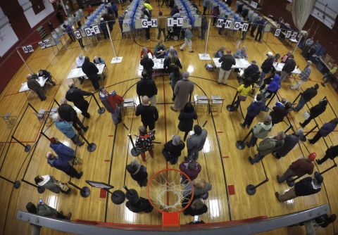 Voters wait in line at a high-school gymnasium in Brunswick, Maine.