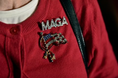 A Donald Trump supporter wears a "Make America Great Again" pin at Gov. Scott Walker's election-night party in Pewaukee, Wisconsin.