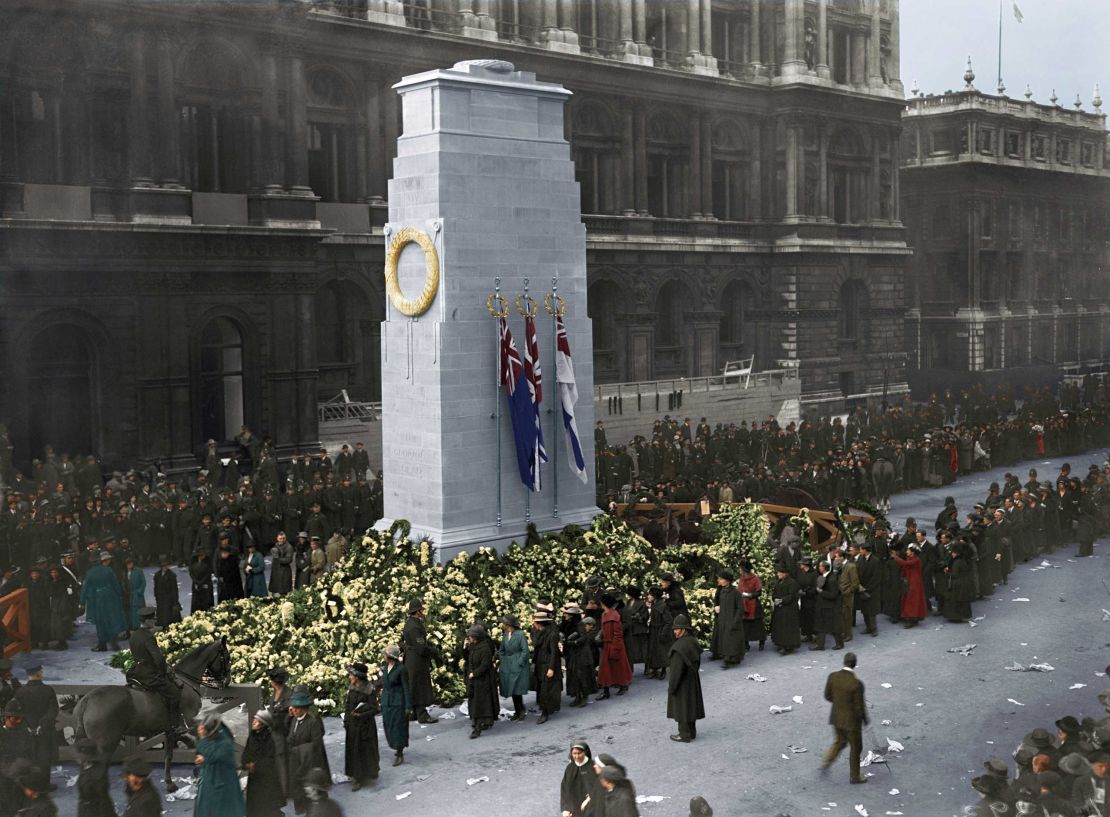 Crowds file past the Cenotaph, a war memorial in London.