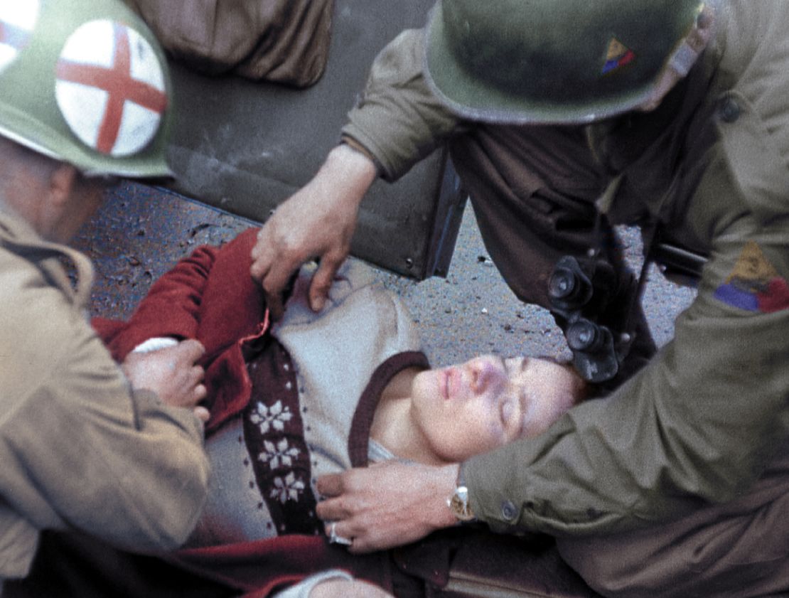 The woman from the car fights for her life as American medics tend to her wounds.