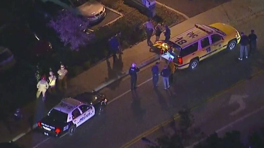 In this image made from aerial video, police vehicles line a road in the vicinity of a shooting in Thousand Oaks, California, early Thursday, Nov. 8, 2018. Authorities say there were multiple injuries _ including one officer _ after a man opened fire in Southern California bar late Wednesday. (KABC via AP)