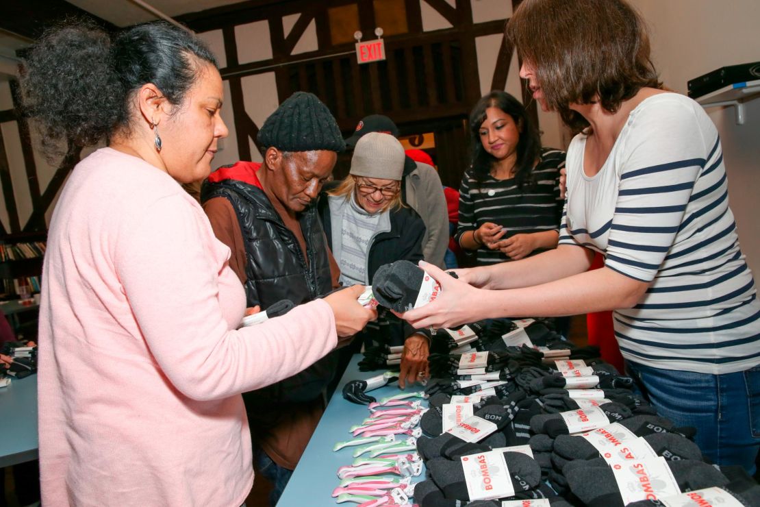Socks and toiletries are handed out at a women's shelter on the Upper East Side in New York.