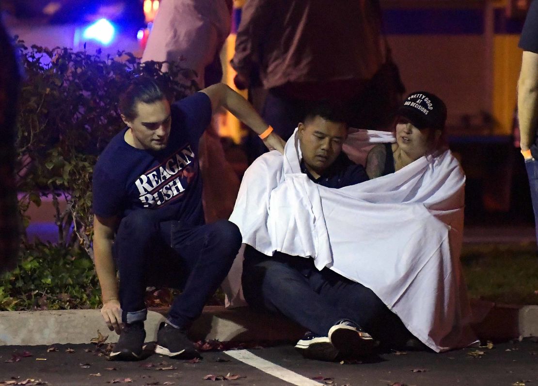 People comfort each other near the shooting scene  early Thursday in Thousand Oaks.