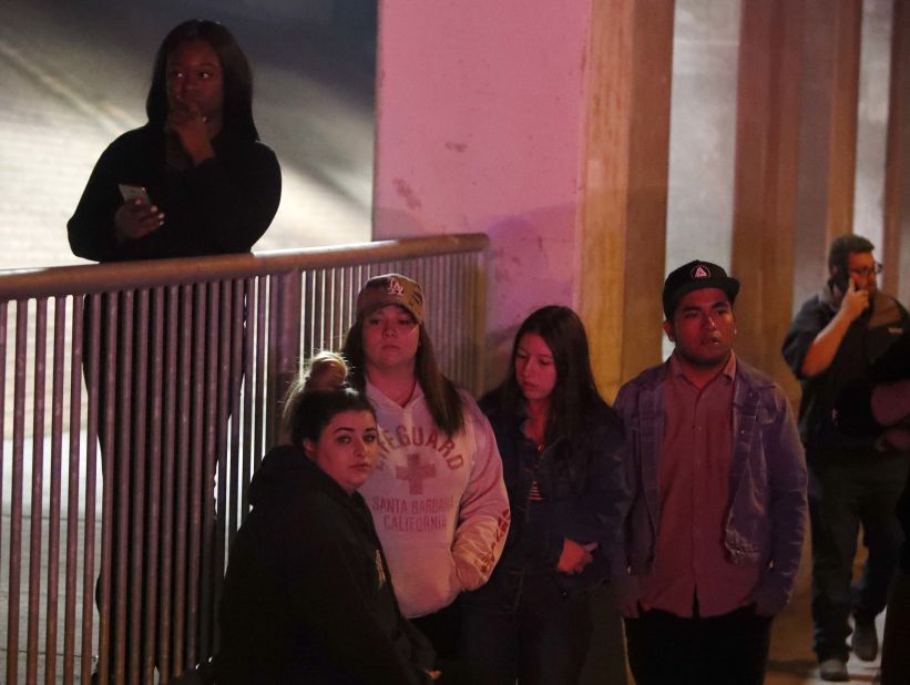 People await news about their friends in the Borderline Bar & Grill shooting.