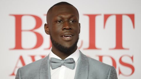 Stormzy poses on the red carpet at the BRIT Awards in February 2018, where he won the award for British Album of the Year.
