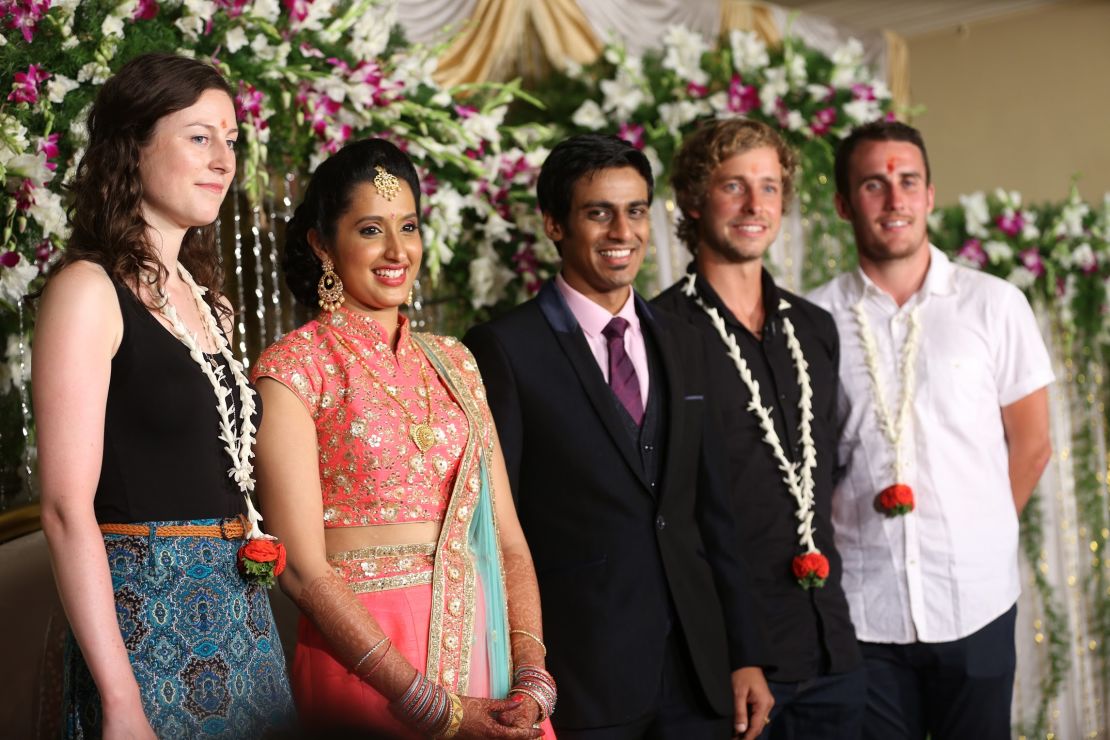 Namrata Nataraj and her partner, pictured center, opened up their wedding to travelers via JoinMyWedding