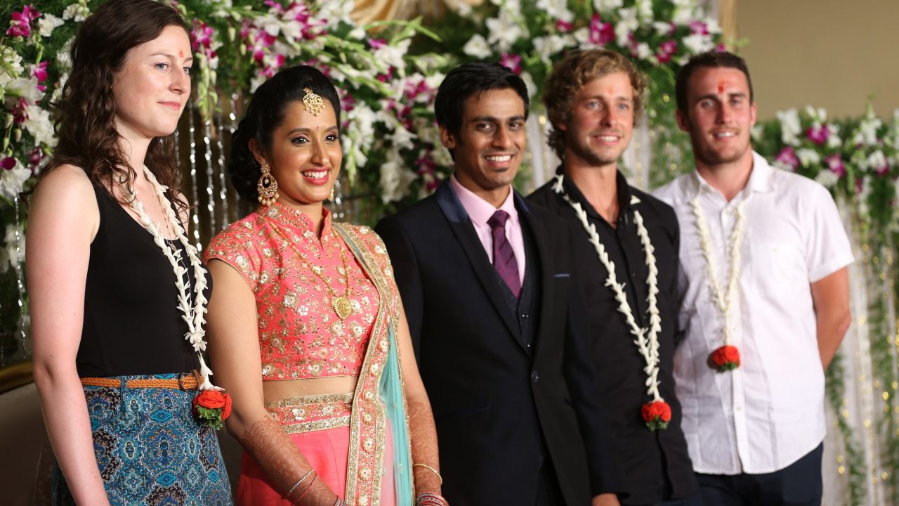 Namrata Nataraj and her partner, pictured center, opened up their wedding to travelers via JoinMyWedding