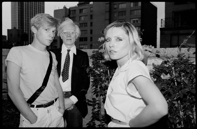 Debbie Harry with actor Dennis Christopher and artist Andy Warhol in New York City.