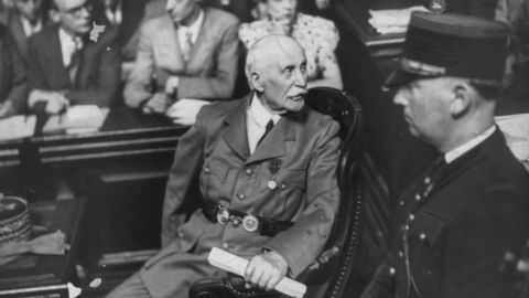 Marshal Philippe Pétain (left) is pictured in a courtroom during his 1945 treason trial.