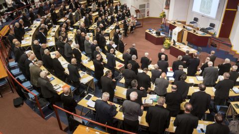 French bishops stand in prayer at the opening of the French Bishops Conference (CEF) annual conference at the Sanctuaires de Lourdes on November 3.