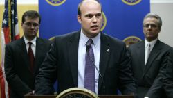 U.S. Attorney Matthew Whitaker speaks during a news conference as James Vandenberg, Office of Inspector General for the Dept. of Labor, left, and Iowa state Auditor David Vaudt, right, look on, Tuesday, Jan. 16, 2007, in Des Moines, Iowa.  A federal grand jury on Tuesday returned a 27-count indictment against five people in a Des Moines area job training agency pay scandal.