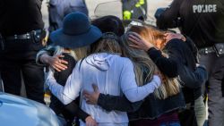 Friends hug outside the Los Robles Medical Center in Thousands Oaks, California on November 8, 2018, as they pay tribute to Ventura Country sheriff Sgt. Ron Helus who was killed in a shooting at Borderline Bar the night before. - The gunman who killed 12 people in a crowded California country music bar has been identified as 28-year-old Ian David Long, a former Marine, the local sheriff said Thursday. The suspect, who was armed with a .45-caliber handgun, was found deceased at the Borderline Bar and Grill, the scene of the shooting in the city of Thousand Oaks northwest of downtown Los Angeles.