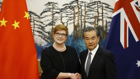 Australian Foreign Minister Marise Payne and Chinese Foreign Minister Wang Yi shake hands at a news conference at the Diaoyutai State Guesthouse in Beijing Thursday.