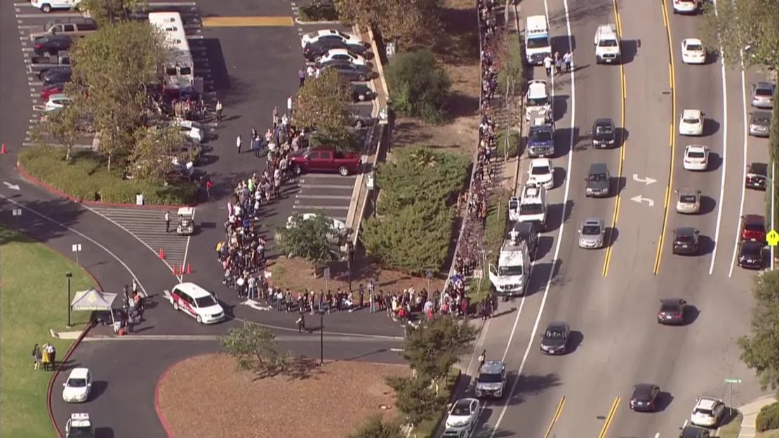 Hundreds of people wait in line to give blood at La Reina High School in Thousand Oaks, California, on Thursday after a gunman walked into the Borderline Bar and Grill and killed 12 people. 