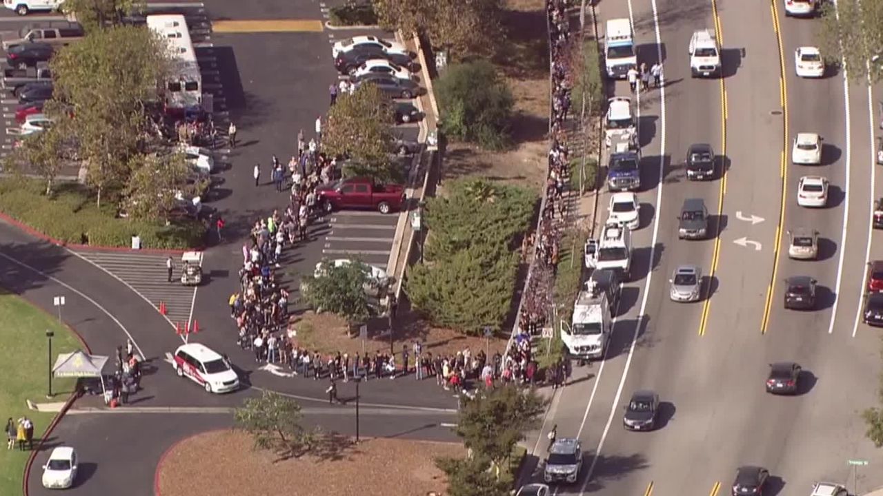 Hundreds of people wait in line to give blood at La Reina High School in Thousand Oaks, California, on Thursday after a gunman walked into the Borderline Bar and Grill and killed 12 people. 