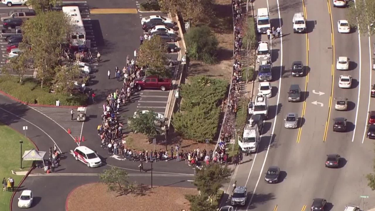 Hundreds of people wait in line to give blood at La Reina High School in Thousand Oaks, California, on Thursday after a gunman walked into the Borderline Bar and Grill and killed 12 people.