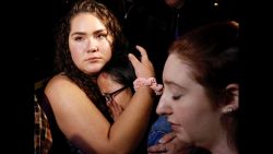 THOUSAND OAKS, CA - NOVEMBER 08:  Nellie Wong cries as Chyann Worrell holds her and Erika Sigman (R) were all inside when shooting started inside the Borderline Bar & Grill when a shooter wounded seven Wednesday night on November 8, 2018 in Thousand Oaks, California. The gunman burst into the bar around 11:20 p.m., cloaked in all black as he threw smoke bombs and began shooting at targets as young as 18 inside the Borderline Bar & Grill, authorities and witnesses said. (Photo by Al Seib / Los Angeles Times via Getty Images)