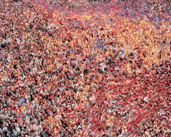 Cyril Porchet's dynamic, painterly "Crowd" photos transform society into swarms. 