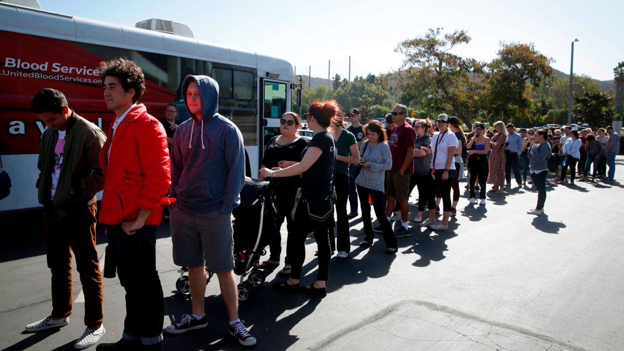 People wait in line Thursday to give blood for the victims of Wednesday night's shooting.