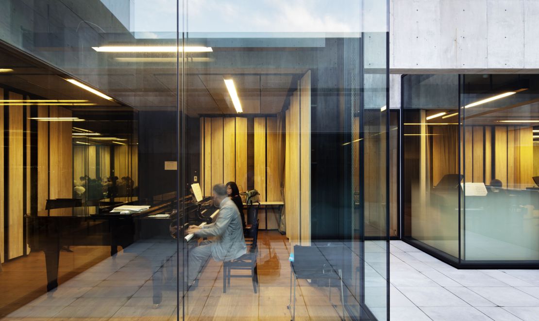 The glass-walled practice rooms increase natural light and encourage eye-contact between musicians. 