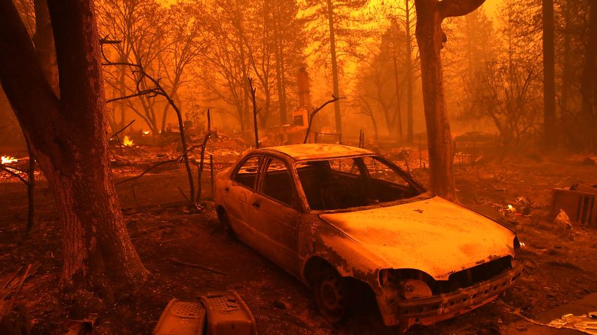 PARADISE, CA - NOVEMBER 08:  A burned out car sits in front of a home that burned as the Camp Fire moves through the area on November 8, 2018 in Paradise, California. Fueled by high winds and low humidity, the rapidly spreading Camp Fire has ripped through the town of Paradise and has quickly charred 18,000 acres and has destroyed dozens of homes in a matter of hours. The fire is currently at zero containment.  (Photo by Justin Sullivan/Getty Images)