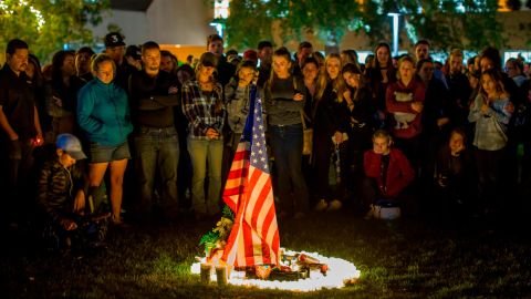 People gather to pay tribute to the victims of a shooting in Thousand Oaks, California, on November 8.