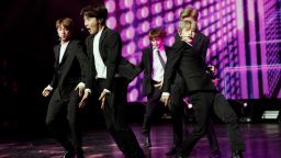 TOPSHOT - South Korean pop group BTS performs during a Korean cultural event as part of South Korean president official visit to France, on October 14, 2018 in Paris. (Photo by YOAN VALAT / POOL / AFP)        (Photo credit should read YOAN VALAT/AFP/Getty Images)