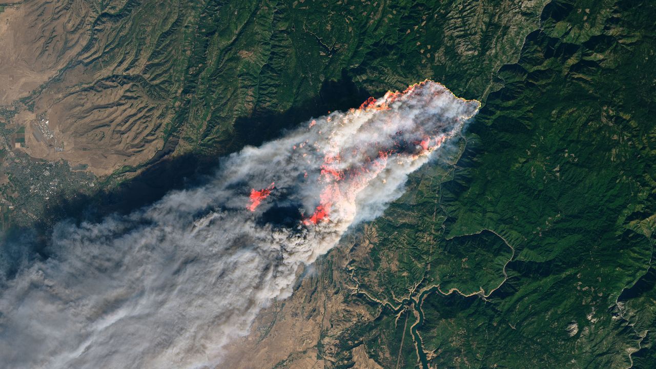 A satellite image taken by NASA's Operational Land Imager shows the Camp Fire in Northern California.