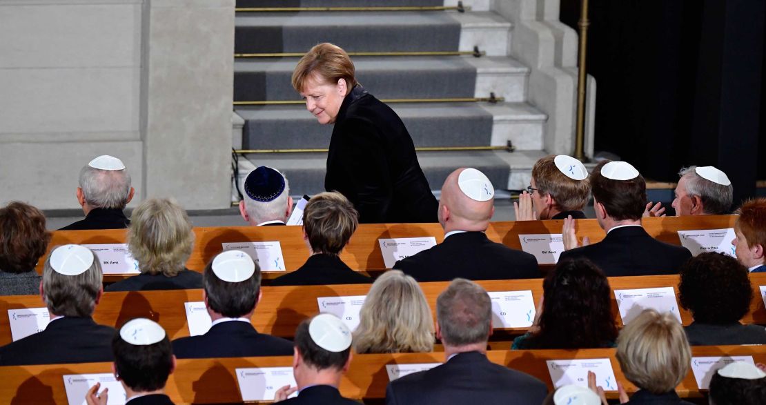 Merkel takes her seat again after speaking the Rykestrasse Synagogue in Berlin on Friday.