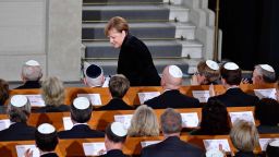 German Chancellor Angela Merkel takes her seat again after speaking during a ceremony at the Synagogue Rykestrasse in Berlin on November 9, 2018 to commemorate the 80th anniversary of the Kristallnacht Nazi pogrom. - Germany remembers victims of the Nazi pogrom that heralded the start of the Third Reich's drive to wipe out Jews, at a time when anti-Semitism is resurgent in the West. (Photo by Tobias SCHWARZ / AFP)        (Photo credit should read TOBIAS SCHWARZ/AFP/Getty Images)
