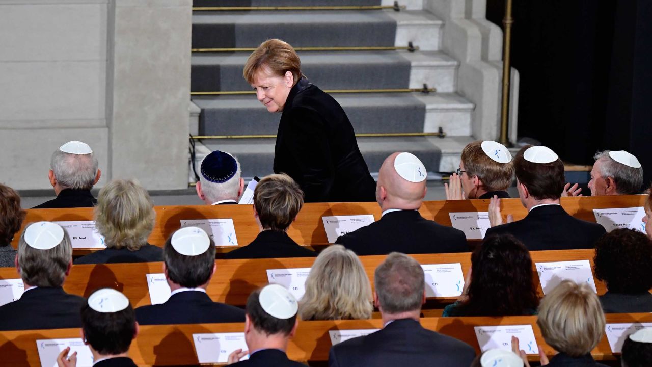 Merkel takes her seat again after speaking the Rykestrasse Synagogue in Berlin on Friday.
