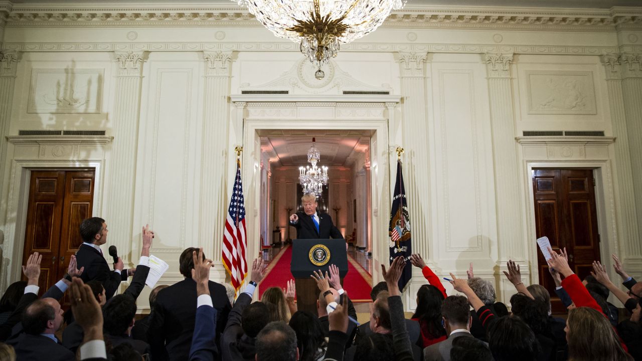 Trump was combative with reporters the day after the elections, doubling down on his assertion that migrants in Mexico were would-be invaders.