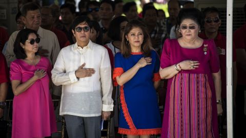 Ferdinand "Bongbong" Marcos Jr, former senator and son of the late Philippines dictator Ferdinand Marcos, his sister Imee and their mother, former first lady Imelda Marcos, listen to the national anthem during a wreath-laying ceremony at a monument to the late dictator during celebrations to mark his 100th birthday in Ilocos Norte province in 2017. 