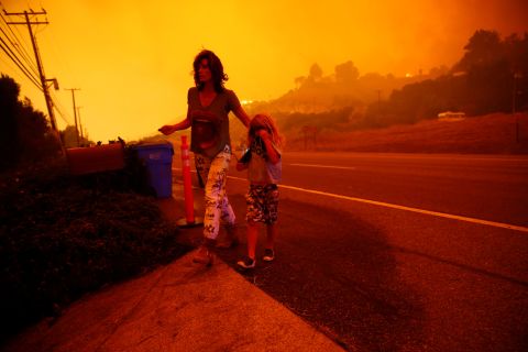 Gabi and Jonah Frank walk on the Pacific Coast Highway as the Woolsey Fire threatens their Malibu home on November 9.