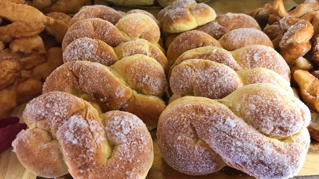 A local grandmother makes traditional wedding cakes.