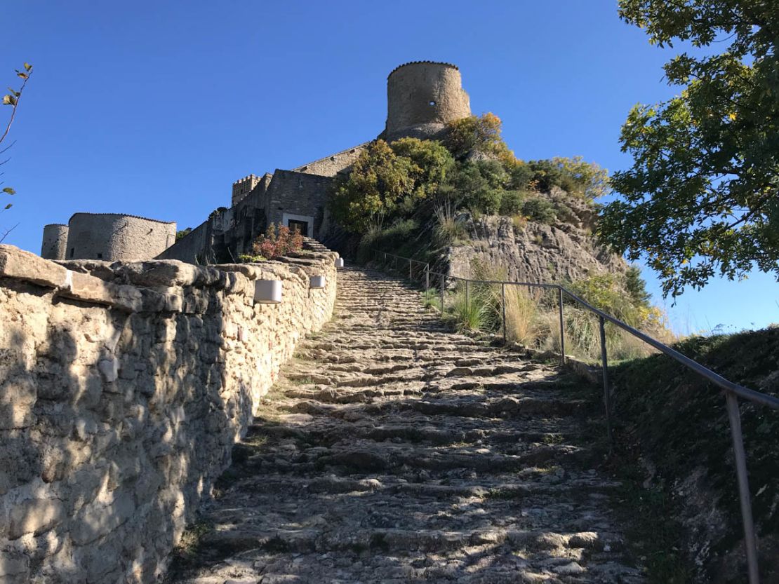 A stone staircase is the only way to reach the castle.