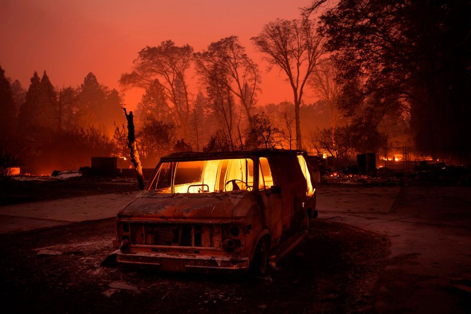 Flames burn inside a van as the Camp Fire tears through Paradise on November 8.