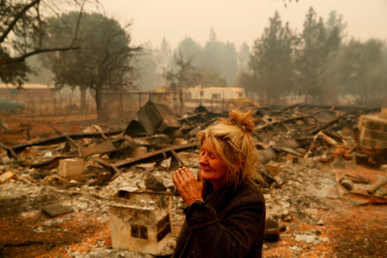 Cathy Fallon stands near the charred remains of her Paradise home on November 9. The Camp Fire has wiped out much of the town north of Sacramento.