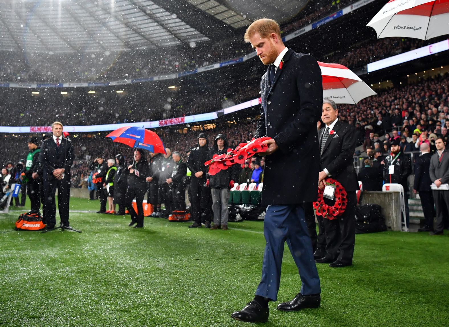 Britain's Prince Harry prepares to lay a wreath before the England and New Zealand rugby match at Twickenham Stadium in London on November 10.