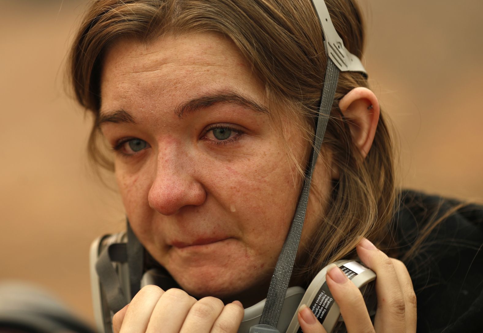 Araya Cipollini cries November 10 near the remains of her family's home in Paradise.